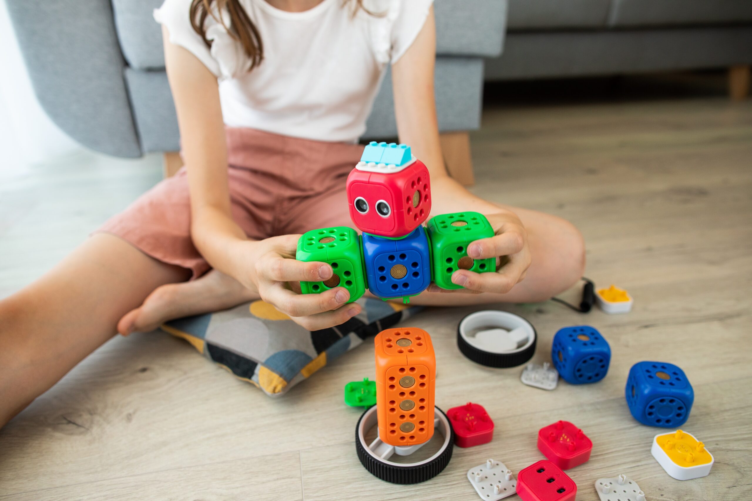An image showcasing a diverse group of children engaged in play with a wide range of educational toys, displaying expressions of curiosity, focus, and joy, highlighting the transformative impact of these toys on child development